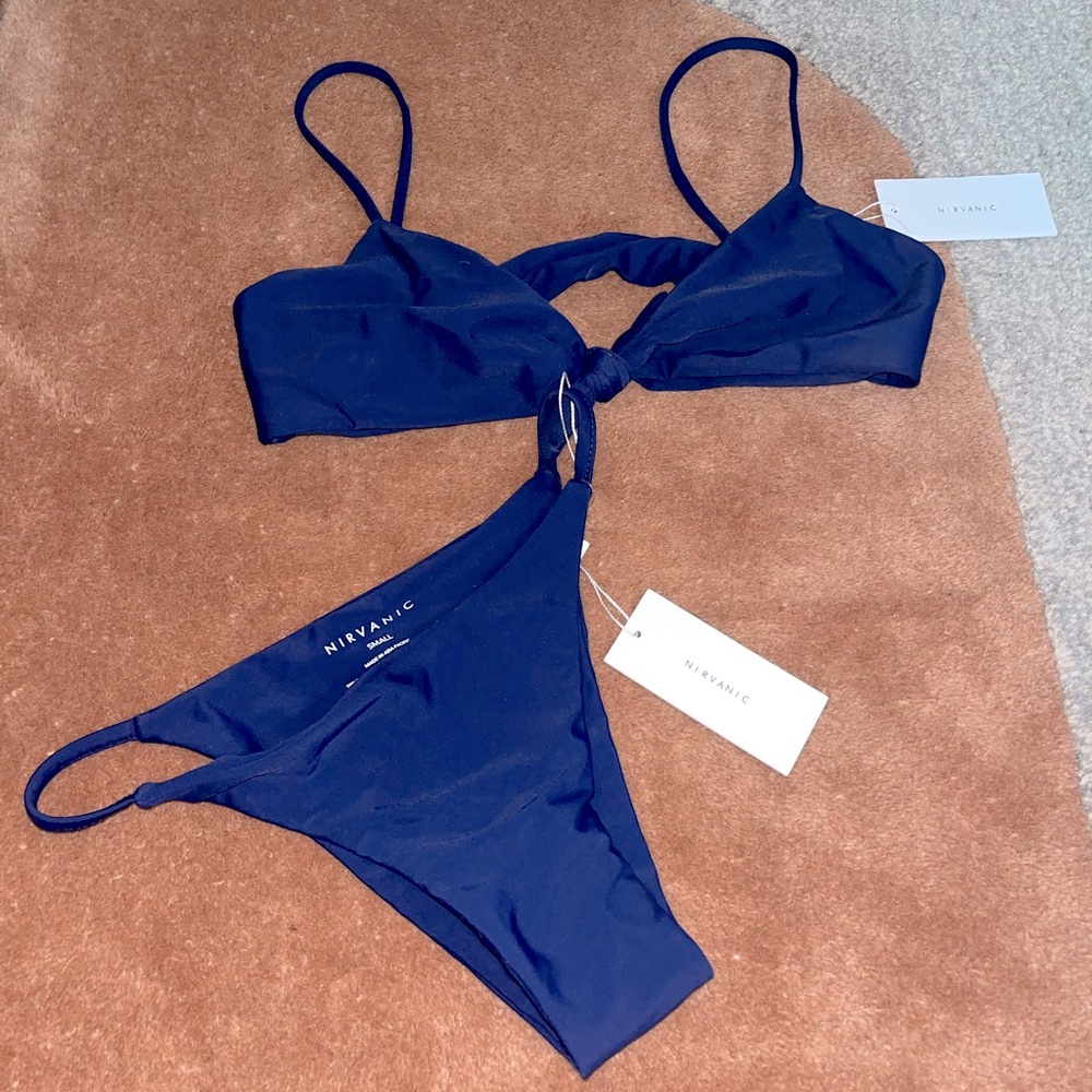NIRVANIC Navy Bikini. Size M tie top w/adjust. straps. Size S Hali bottoms.